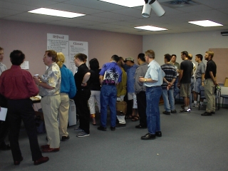 Crowd gathered around computers